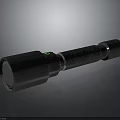 Black Handheld Flashlight Hardware Tool With Green Button And Textured Surface Design