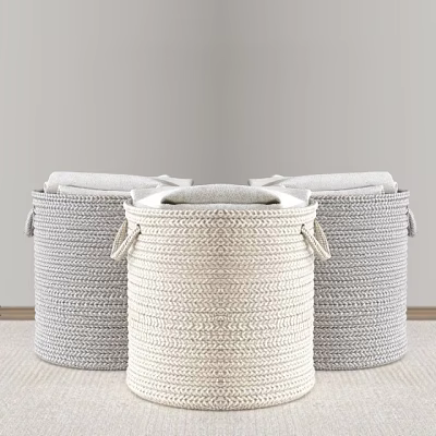 Three Woven Storage Baskets in Gray and Beige for Organizing Folded Clothes at Home 3d model