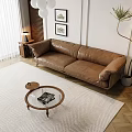 Brown Leather Sofa and Round Wooden Coffee Table Set in Living Room with Decorative Paintings
