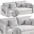 Gray And White Sofa Design With Striped Blankets Pillows And Decorative Balls
