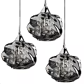 Three Modern Crystal Chandeliers With Wave Shaped Design And Metal Accents
