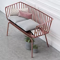 Rose Gold Frame Two-Seater Sofa With Grey Cushions Beige Pink Pillows And Green Plants In Grey Pots