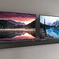 Two Wall Mounted TVs Displaying Natural Scenery With Mountains And Lake
