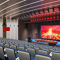 Large Conference Hall Interior With Stage Large Screen Party Emblem Red Background And Arranged Seats