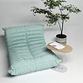 Light Green Bean Bag Sofa With Small Side Table Book And Potted Plant