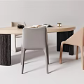 Wooden Oval Desk With Open Magazine Black Mug Gold Decorative Items And Gray Beige Chairs