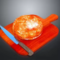 Golden Freshly Baked Artisan Bread On Wooden Cutting Board With Knife