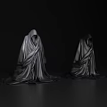 Two Black Hooded Robes With Drapey Fabric On Dark Background