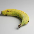Fresh Ripe Yellow Bananas in Black Wire Basket on Gray Background