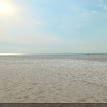 Beautiful Beach Landscape with White Church Cross Sloped Stairs Blue Sky White Clouds and Sea