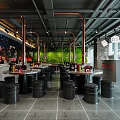 Industrial Style Restaurant Interior With Copper Pipes Green Plant Wall Round Tables And Black Stools