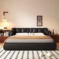 Black Leather Double Bed With Brown And Gray Blankets Bedside Tables Lamp And Wall Art
