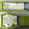 Modern Office Glass Partition With Success Tea Text And Green Wall Design
