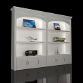 White Illuminated Display Shelf With Model Airplanes Trucks And Decorative