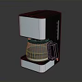 Sleek Modern Black And Silver Coffee Maker With Stainless Steel Body And Glass Carafe