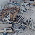 Pile of Construction Debris with Wooden Planks Metal Scrap and Rubble