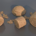 Round Hay Bales And Scattered Hay Piles In Natural Rural Setting