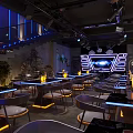 Modern Chic Bar Interior With Blue Lighting Black Furniture And Neon Decor