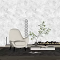 Beige Textured Armchair With Black Legs White Round Floor Lamp Green Plant And Light Wall