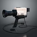 Vintage Digital Video Camera Featuring Large Lens White And Black Body Cable And Stand