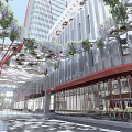 Modern Office Building Exterior With Greenery Covered Facade Red Structural Elements And Glass Walls