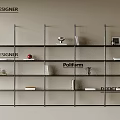 Modern Designer Bookshelf With Black Frame And Layered Shelves Holding Books And Decorative Items