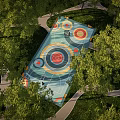 Park Landscape With Colorful Circular Recreational Area Surrounded By Trees And Winding Paths