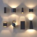 Modern Wall Lamps With Various Contemporary Designs Illuminated On White Wall Surface