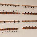 Various Wall Mounted Hooks With Wooden And Metal Designs For Home Decor