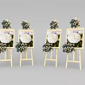 Wooden Art Easels With Framed White Flower Paintings And Decorative Bouquets