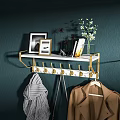 Modern Wall Mounted Coat Rack With Gold Hooks White Shelf Picture Frames And Flowers