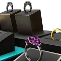 Elegant Jewelry Rings With Purple Gemstones And Golden Bands On Black Display Stands