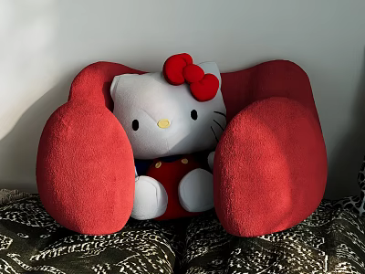 Adorable Hello Kitty Doll On Red Chair With White Body Red Bow And Patterned Cushion 3d model