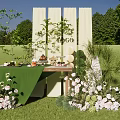 Outdoor Setup With Green Table Food Drinks Pink Flowers Green Plants And White Backdrop