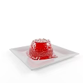Red Jelly Dessert with Shiny Surface Served on White Plate and Decorated with Small Toppings