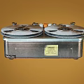 Vintage Open Reel Tape Recorder Classic Household Appliance with Metal Control Panel and Knobs