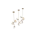 Modern Pendant Lights With Circular Glass Shades And Golden Metal Frames Illuminated