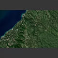 Detailed Coastal Terrain With Green Landscape And Blue Water Features
