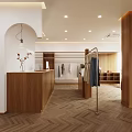 Light and Modern Clothing Store Interior With Clothes Racks Wooden Reception Desk And Herringbone Flooring