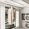 Modern Laundry Room Interior With Hanging Clothes On Rack And Washer Dryer