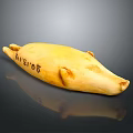 Yellow Bear Shaped Decorative Object With Silver6 Text On Surface