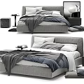 Modern Double Bed Interior With Gray Upholstered Frame Layered Bedding Plush Pillows And Throw Blanket