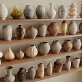Assorted Ceramic Vessels Displayed on Wooden Shelves with Various Shapes and Textures