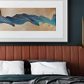 Modern Double Bed with Orange Leather Headboard Deep Blue Wall Art and Gold Sconces