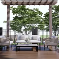 Outdoor Sofa With Armchairs Coffee Table On Wooden Deck Under Pergola Green Trees And Purple Flowers