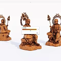 Intricate Wooden Carved Statues Of Seated Figures With Halo And Staff Design