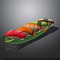 Assorted Fresh Sushi with Tuna Salmon Avocado on Black Slate Plate with Green Leaf
