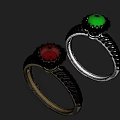 Gold and Silver Rings with Red Green Gemstones and Braided Texture Design