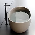 Modern Oval Shaped Cream Colored Bathtub In Bathroom Interior With Black Faucet