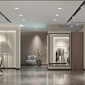 Modern Clothing Store Interior With Clothing Racks Mannequins Seating And Lighting Design